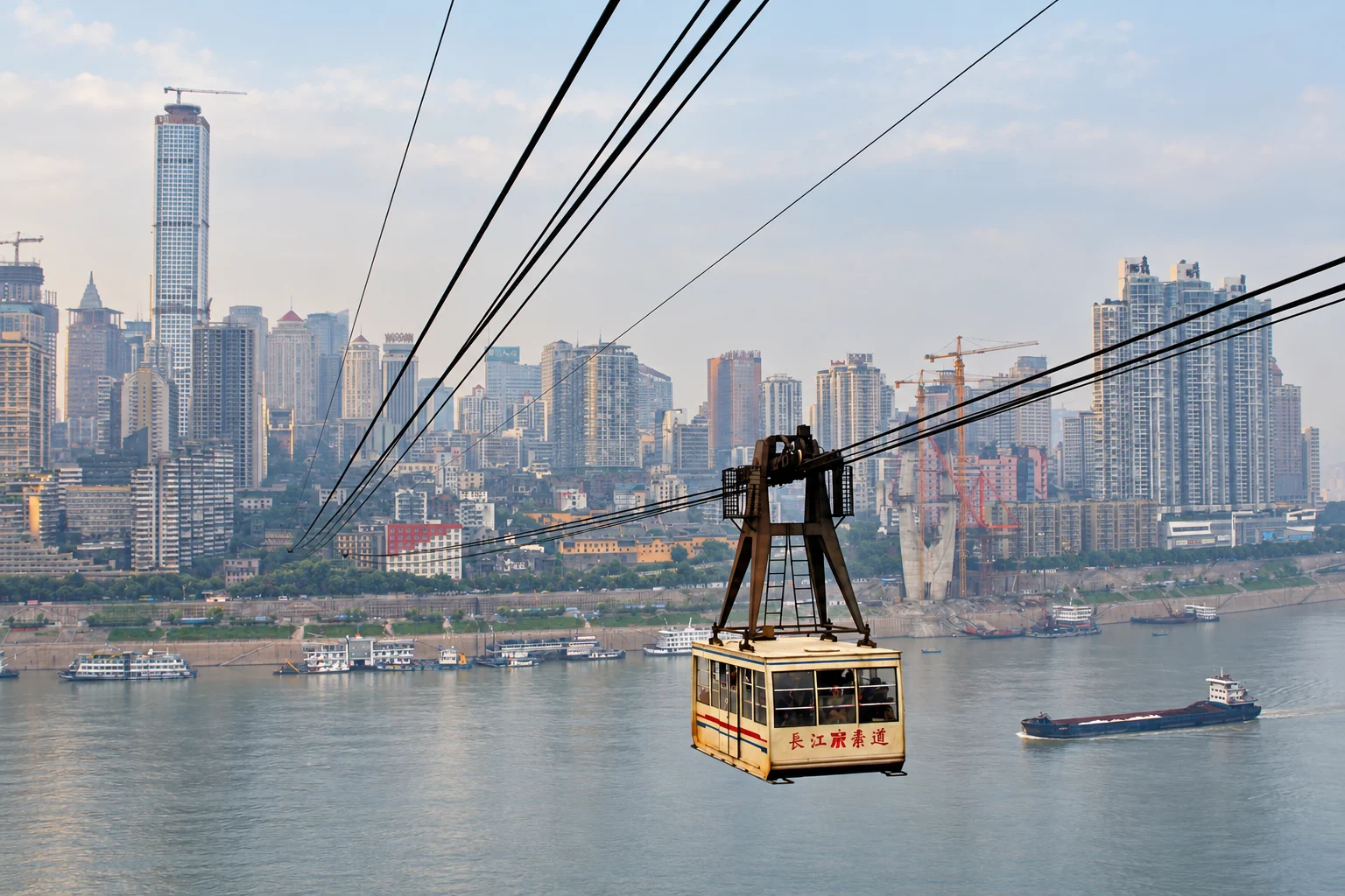 A cream-coloured Yangtze River cable car above the river